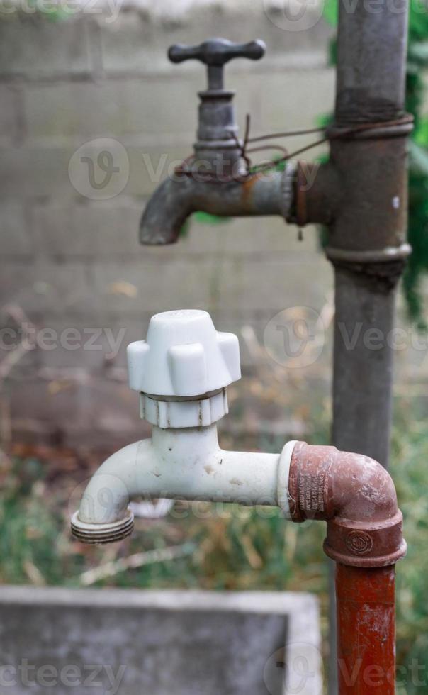 New and old water faucets photo