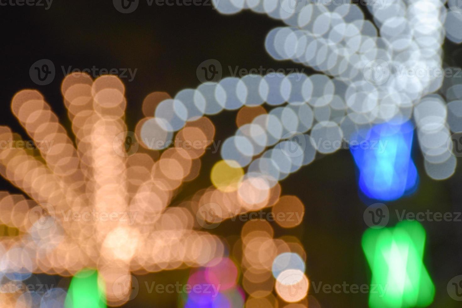 the night lights and colors the rides and the decoration and bokeh photo