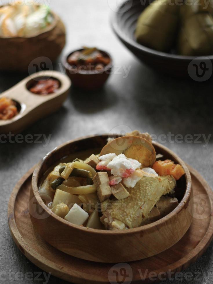 High angle view  of Ketupat Lebaranin a bamboo bowl on the table photo