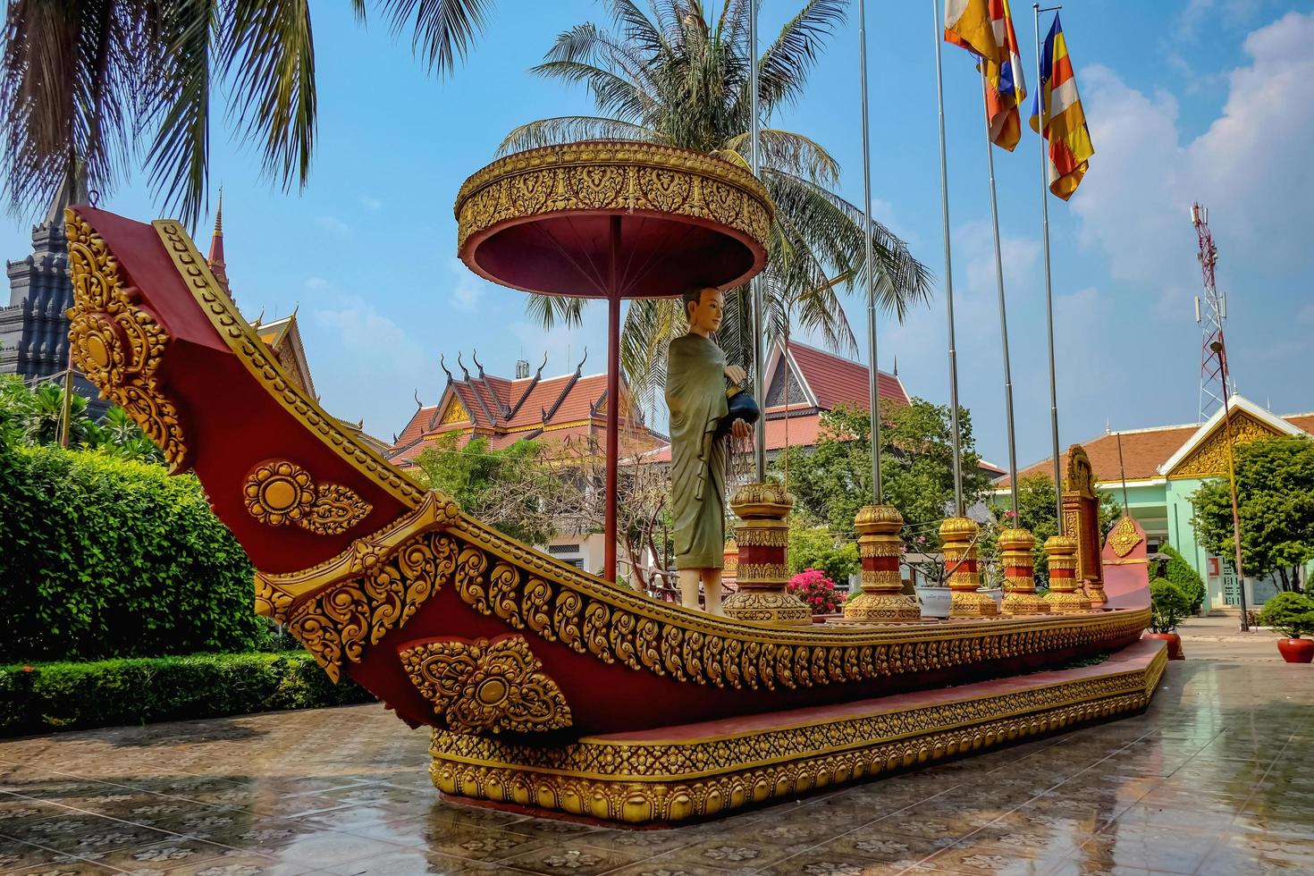 Beautiful boat with the monk statue on the boat in the temple photo