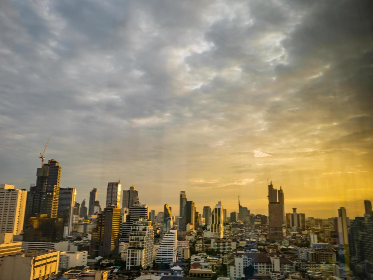 Bangkok city scape with orange sunset sky photo