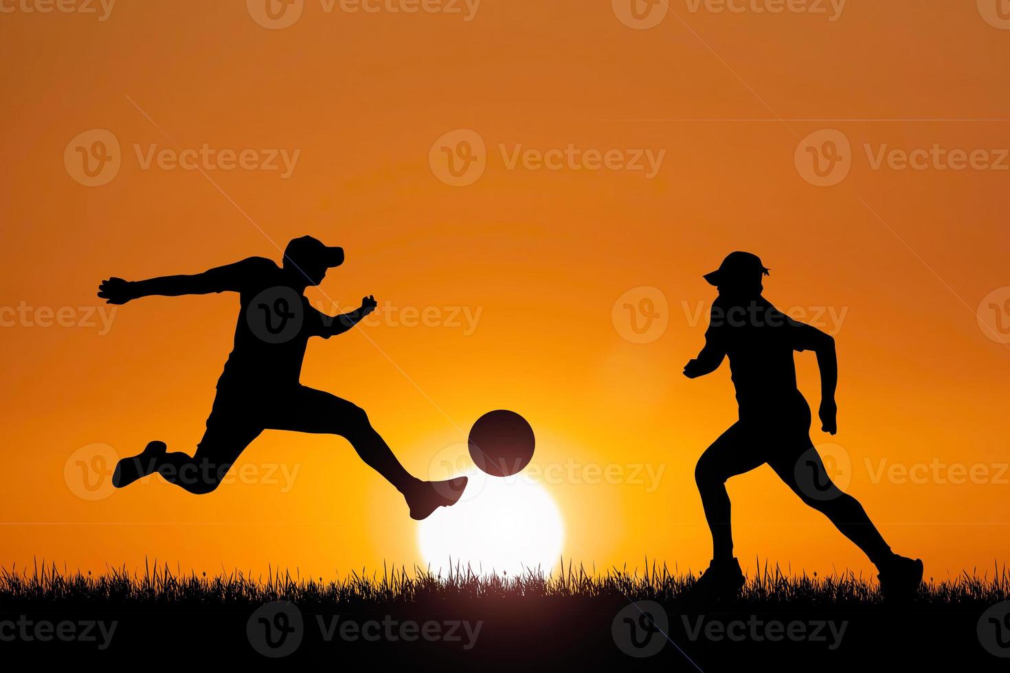 Silhouette of football players in the evening. Football concept is popular all over the world. photo