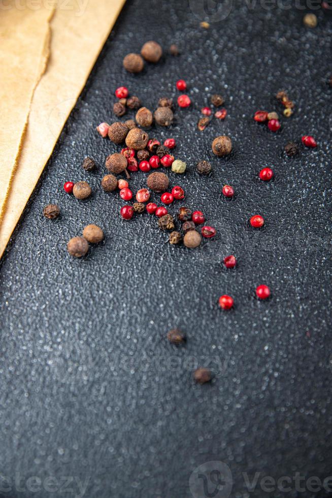 allspice peppercorn mix black, pink, pepper spices healthy meal food diet snack on the table copy space photo