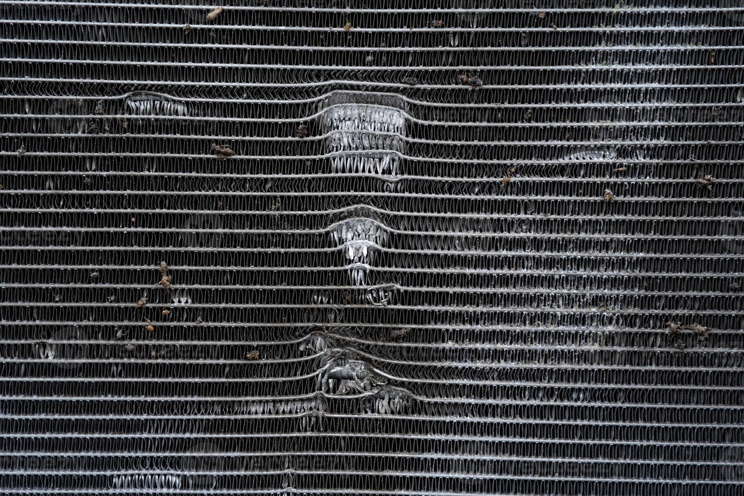 small damaged car radiator close up photo