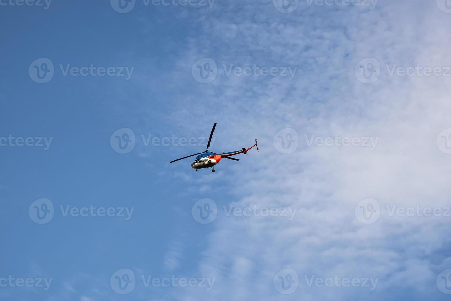 rescue helicopter against the blue sky photo