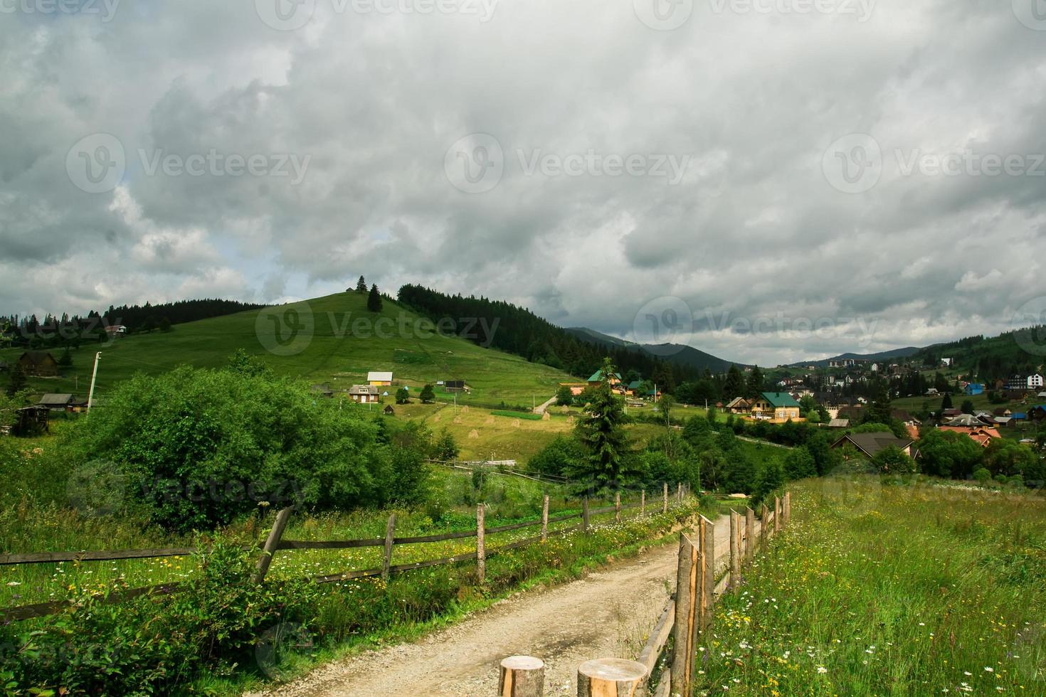 View of the village in the mountains. Summer mountain landscape photo