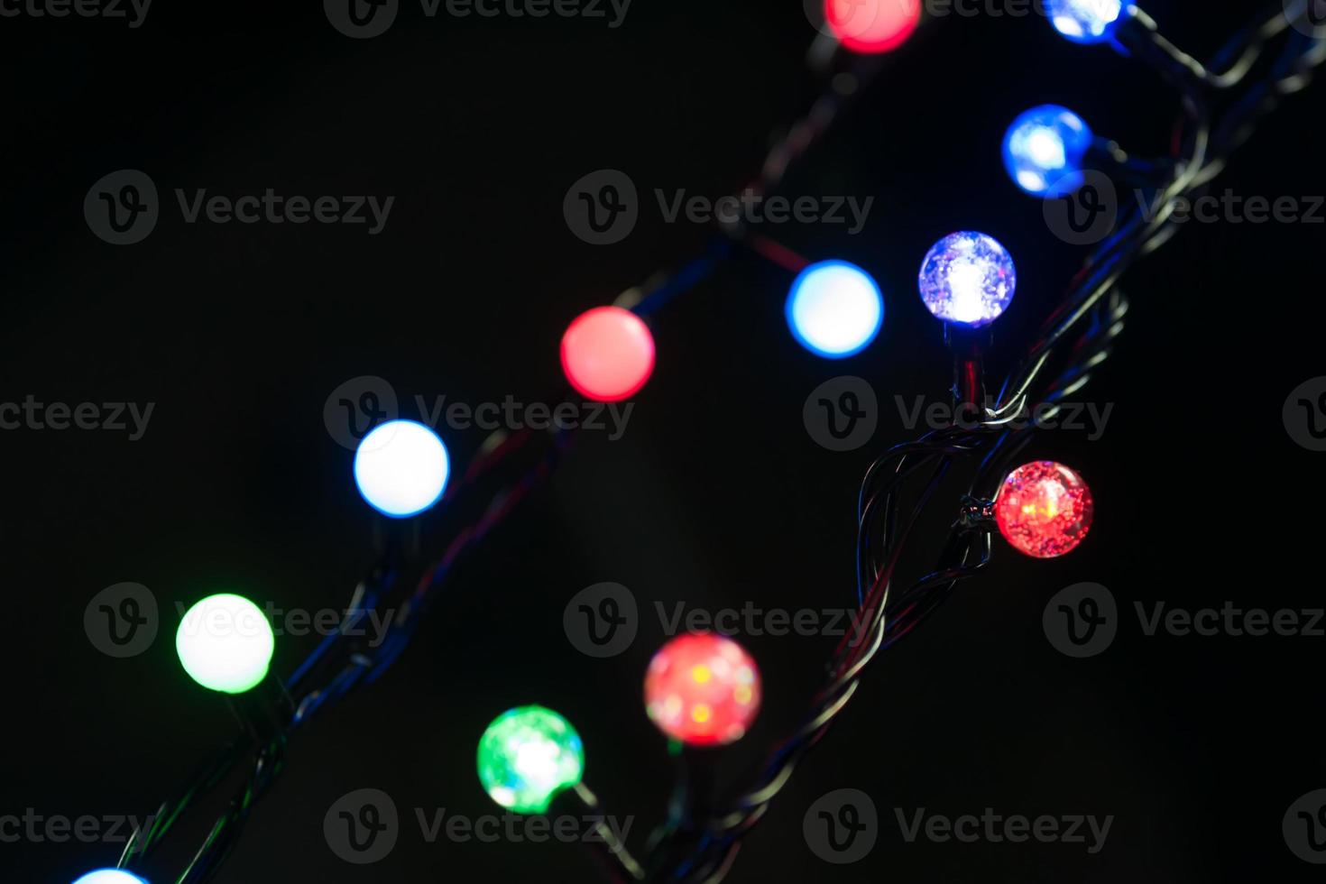 Christmas lights on the Christmas tree with a beautiful bokeh photo