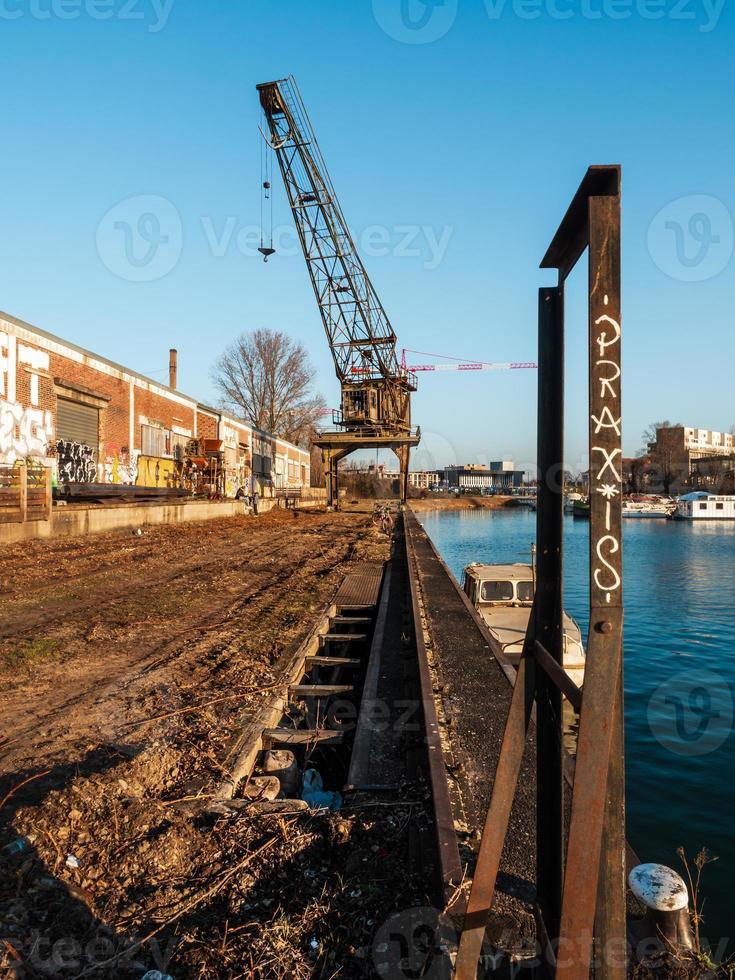 Old port, abandoned buildings, bridges, graffiti on the walls of houses in Strasbourg photo