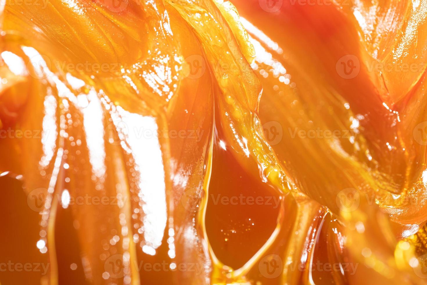 Close up of orange colored industrial grease. Rich and thick texture of industrial grade grease used to smooth out all metal friction. Lubricating grease. close-up of yellow lithium grease for machine photo