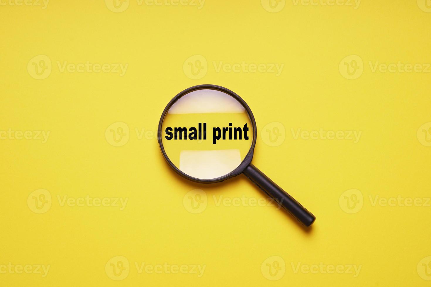 small print enlarged with magnifying glass magnifier loupe photo