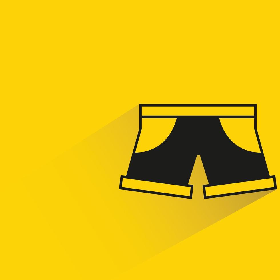 icono de pantalones cortos sobre fondo amarillo vector