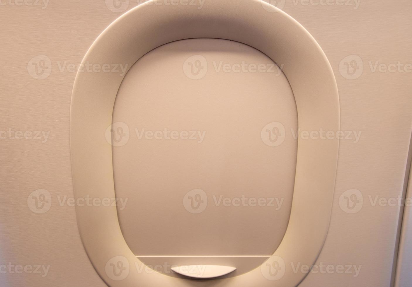 Window of the plane is closed in flight. Theme vacations for the travel agency. photo