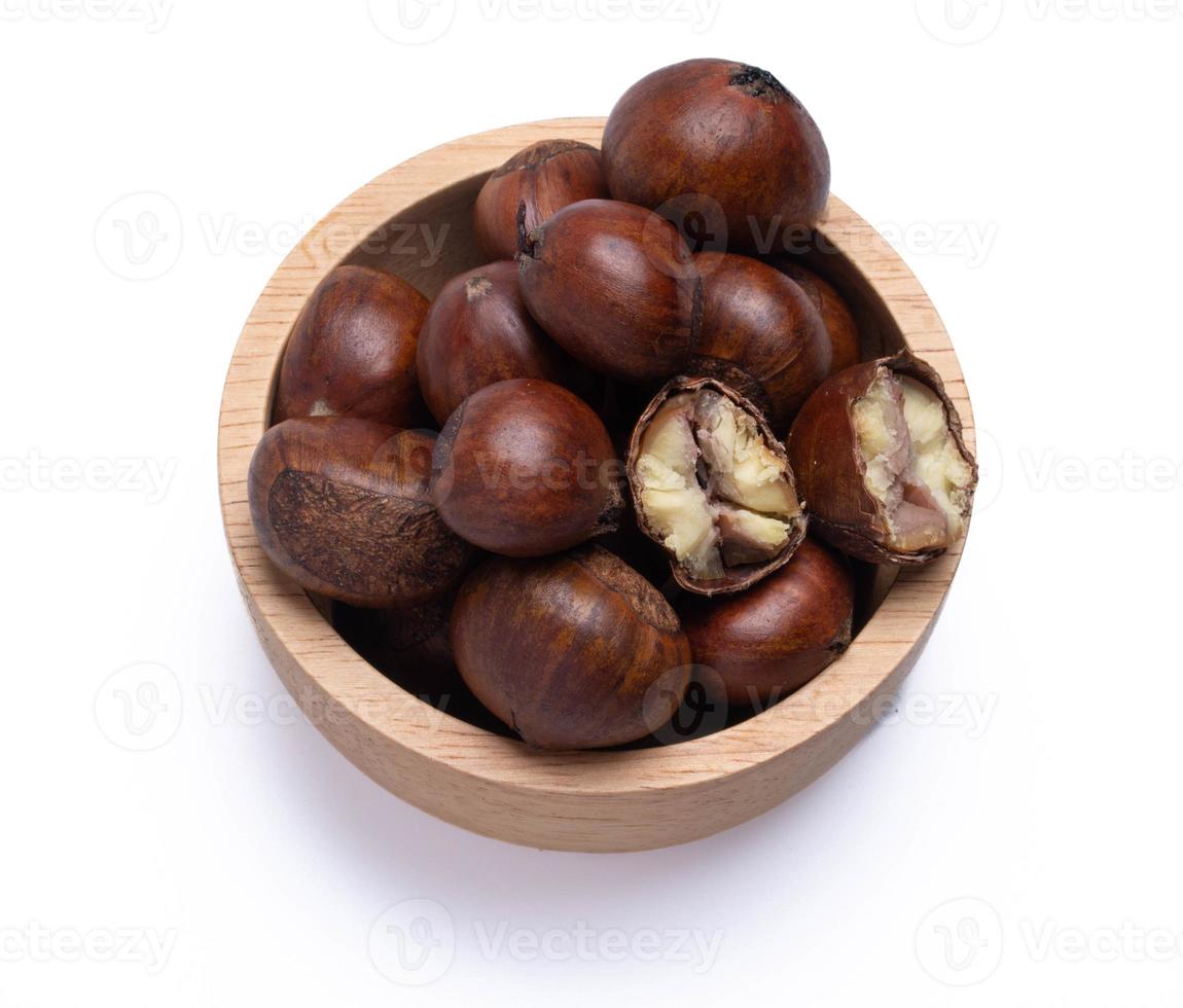 chestnuts in a wooden cup on a white background photo