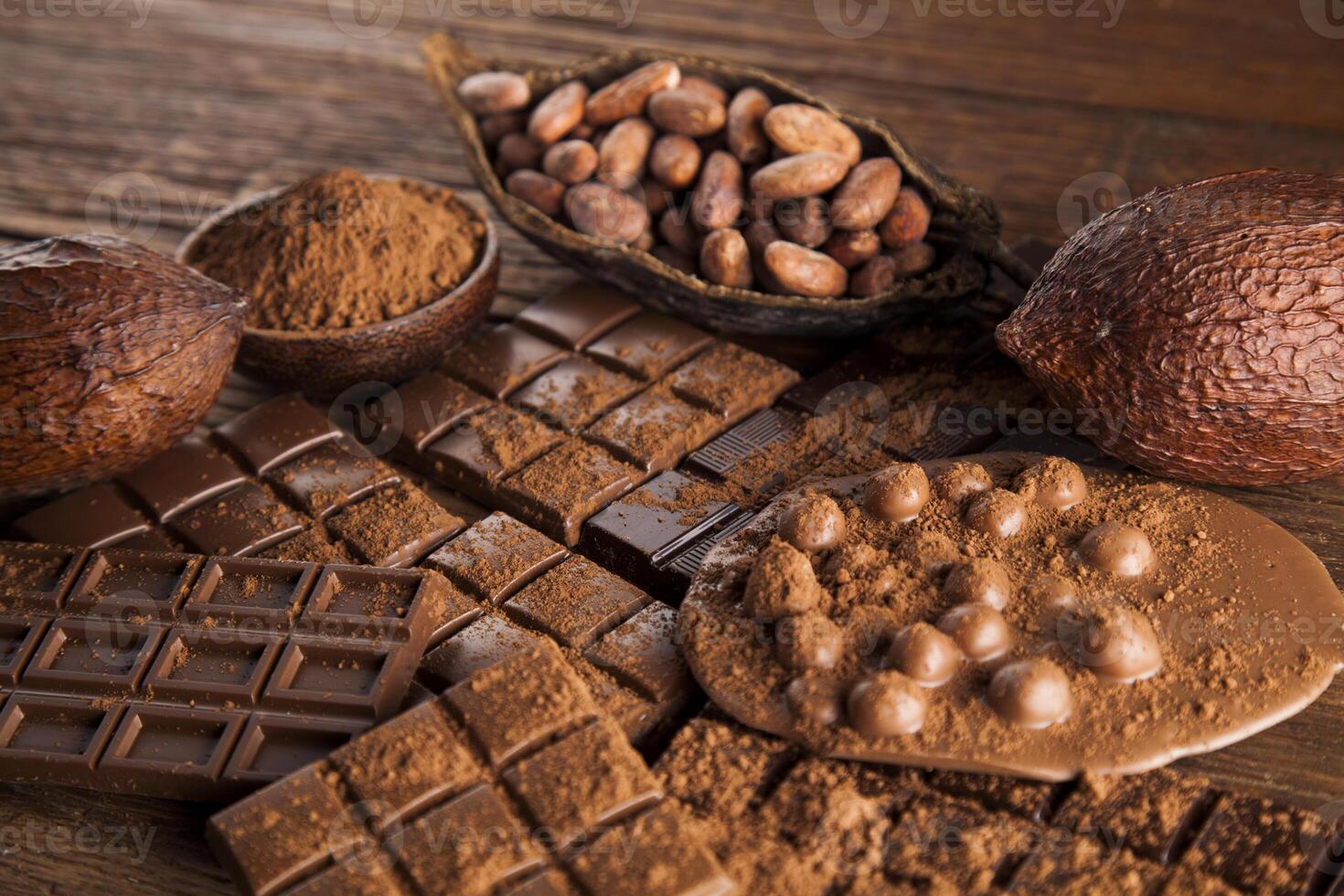 Dark and milk chocolate bar on a wooden table photo