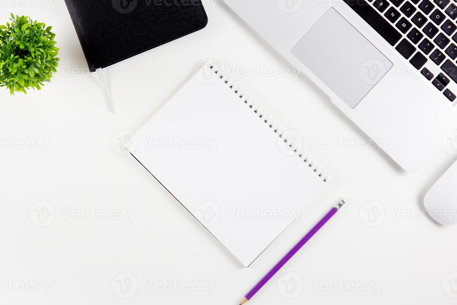 Top view laptop with open display screen monitor, diary and mouse and notepad, glasses and pencil isolated on white background, notebook or netbook with keyboard, communication technology concept. photo