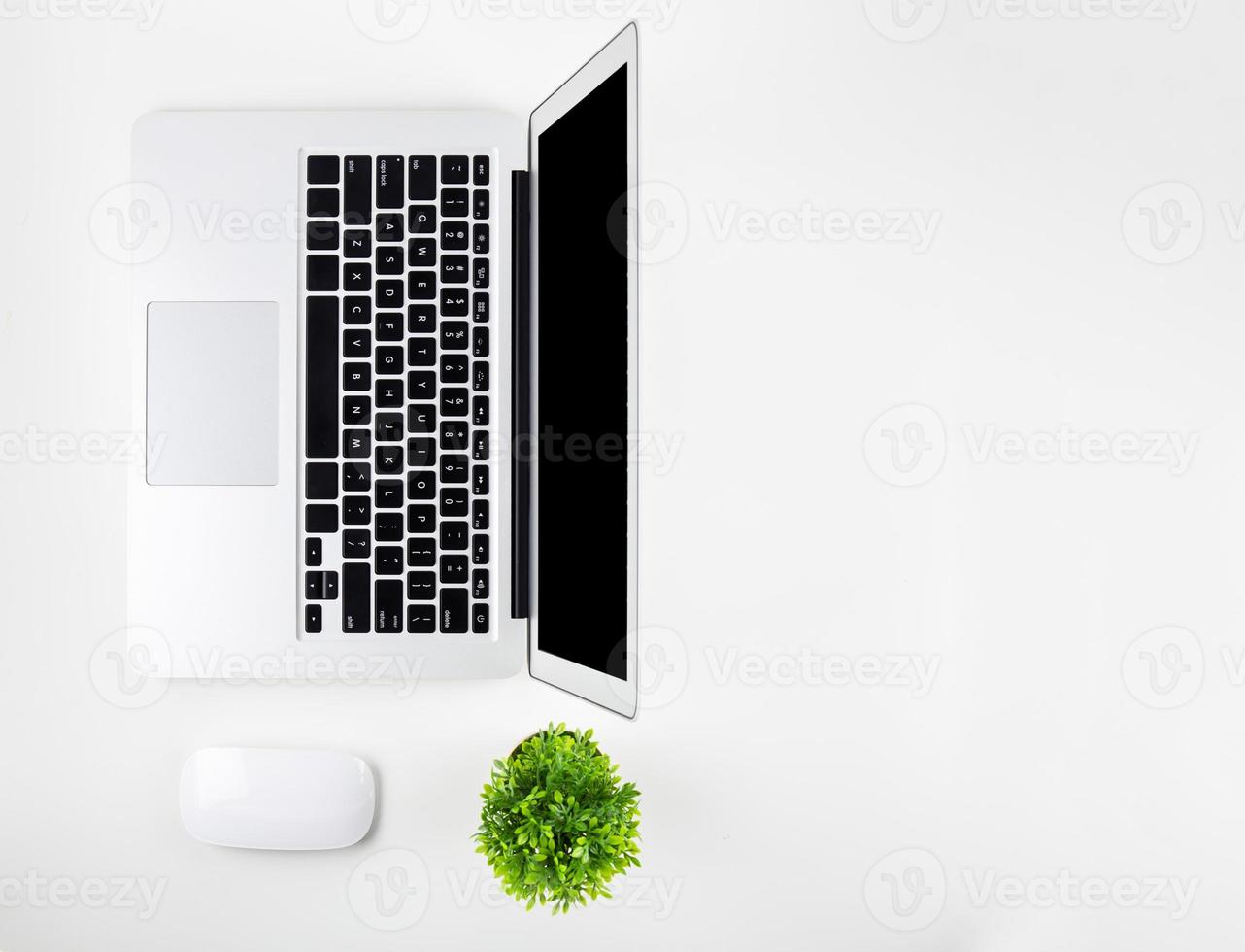 Top view of laptop computer with open display screen monitor, diary and mouse isolated on white background, notebook or netbook, communication technology on work office concept. photo