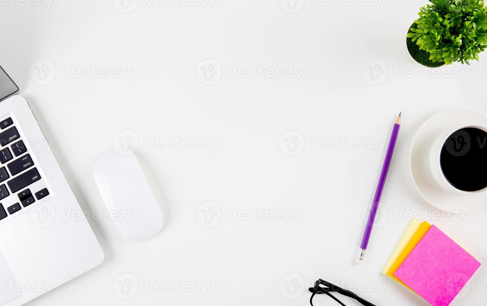 Top view of laptop computer with open display screen monitor, mouse and notepad, glasses and pencil isolated on white background, notebook or netbook with keyboard, communication technology concept. photo