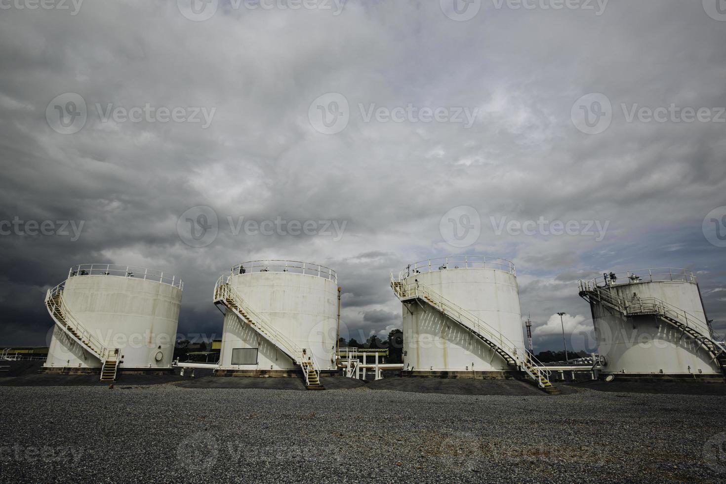 The row of small white tanks for petrol station and refinery photo