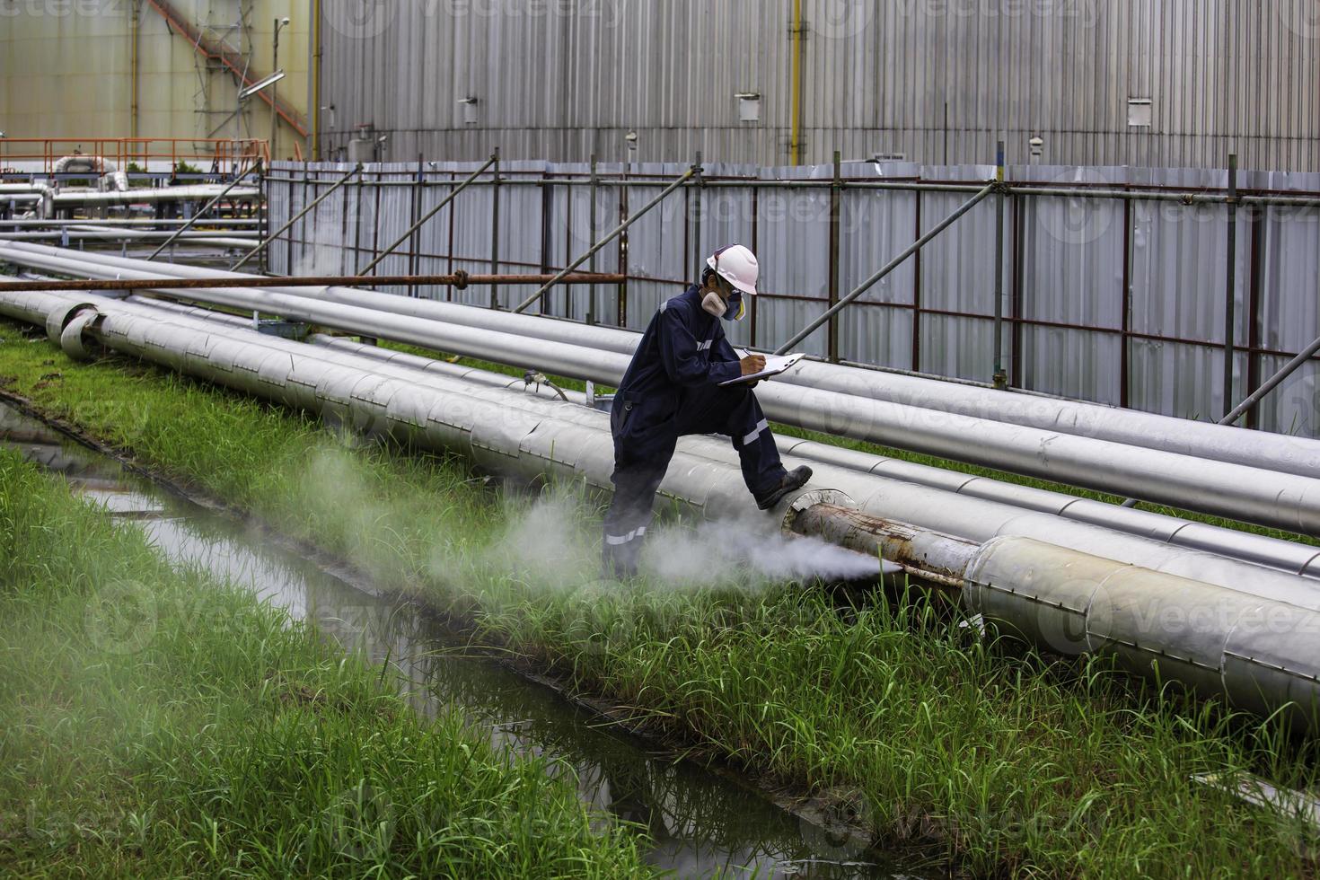 Male worker inspection visual pipeline oil and gas corrosion rust through socket tube steam gas leak pipeline photo