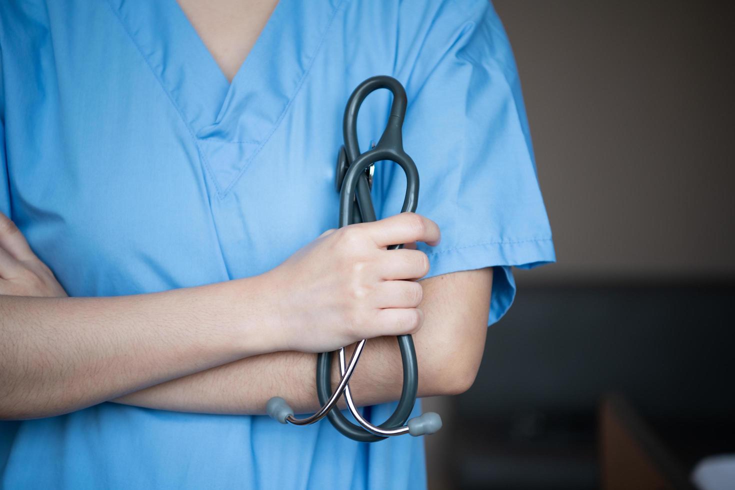 A doctor with a stethoscope used for initial diagnosis photo