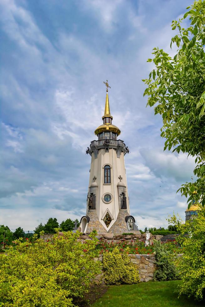 Christian church cross in high steeple tower for prayer photo