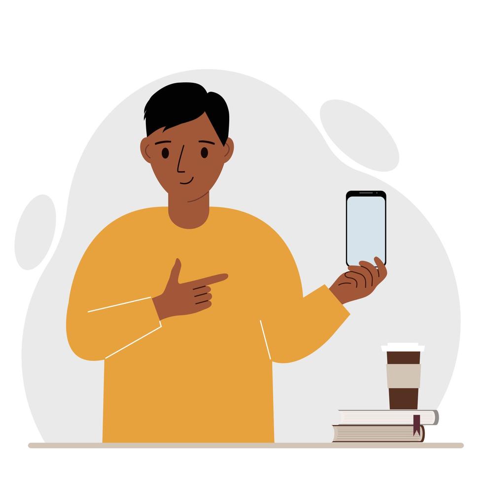 A happy man holds a mobile phone in one hand and points at it with the index finger of his other hand. Vector flat illustration