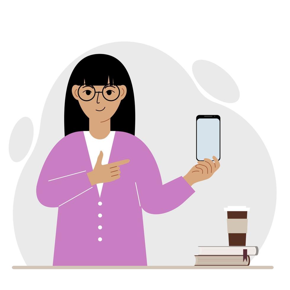 A happy woman holds a mobile phone in one hand and points at it with the index finger of his other hand. Vector flat illustration