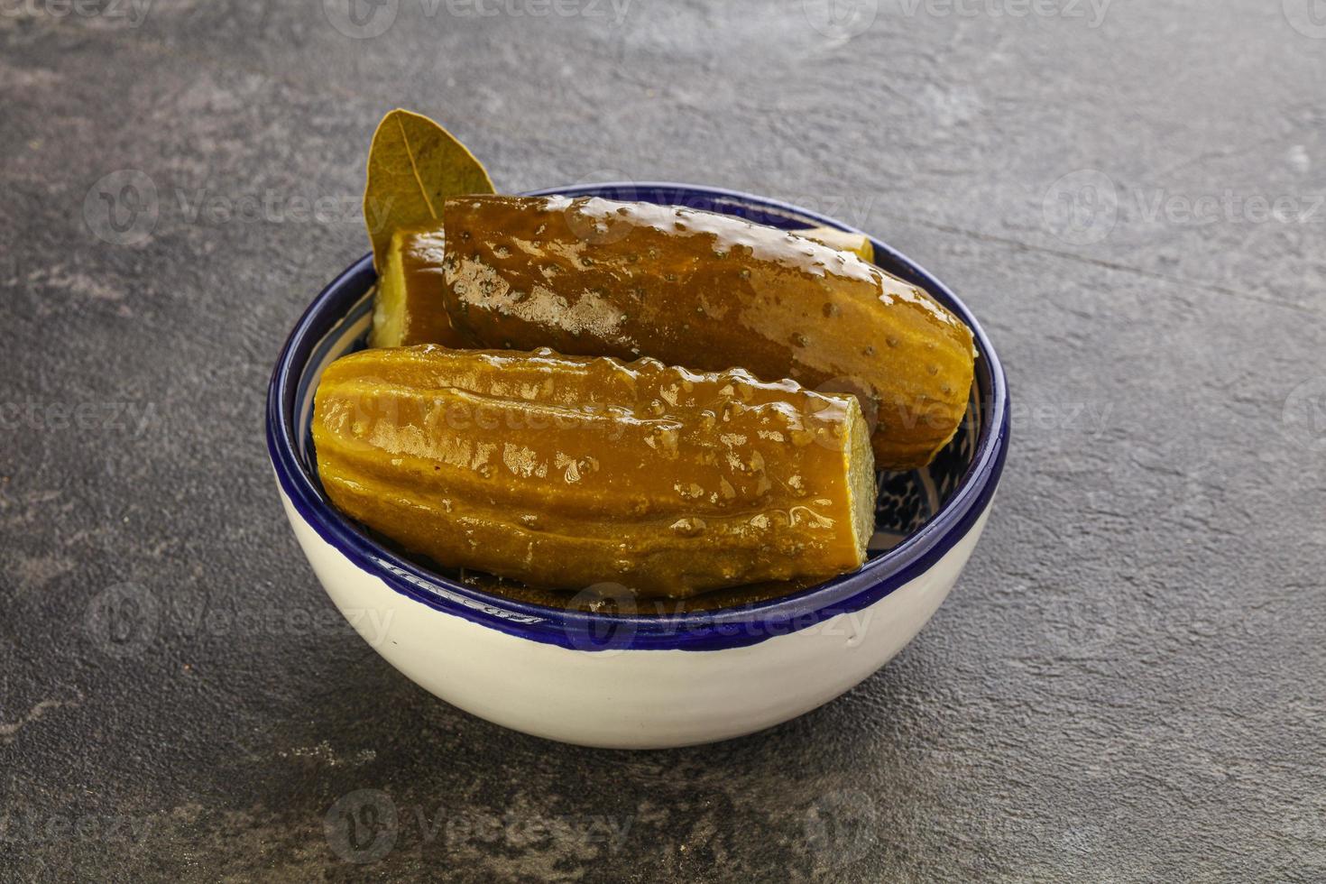 Marinated pickled cucumbers in the bowl photo