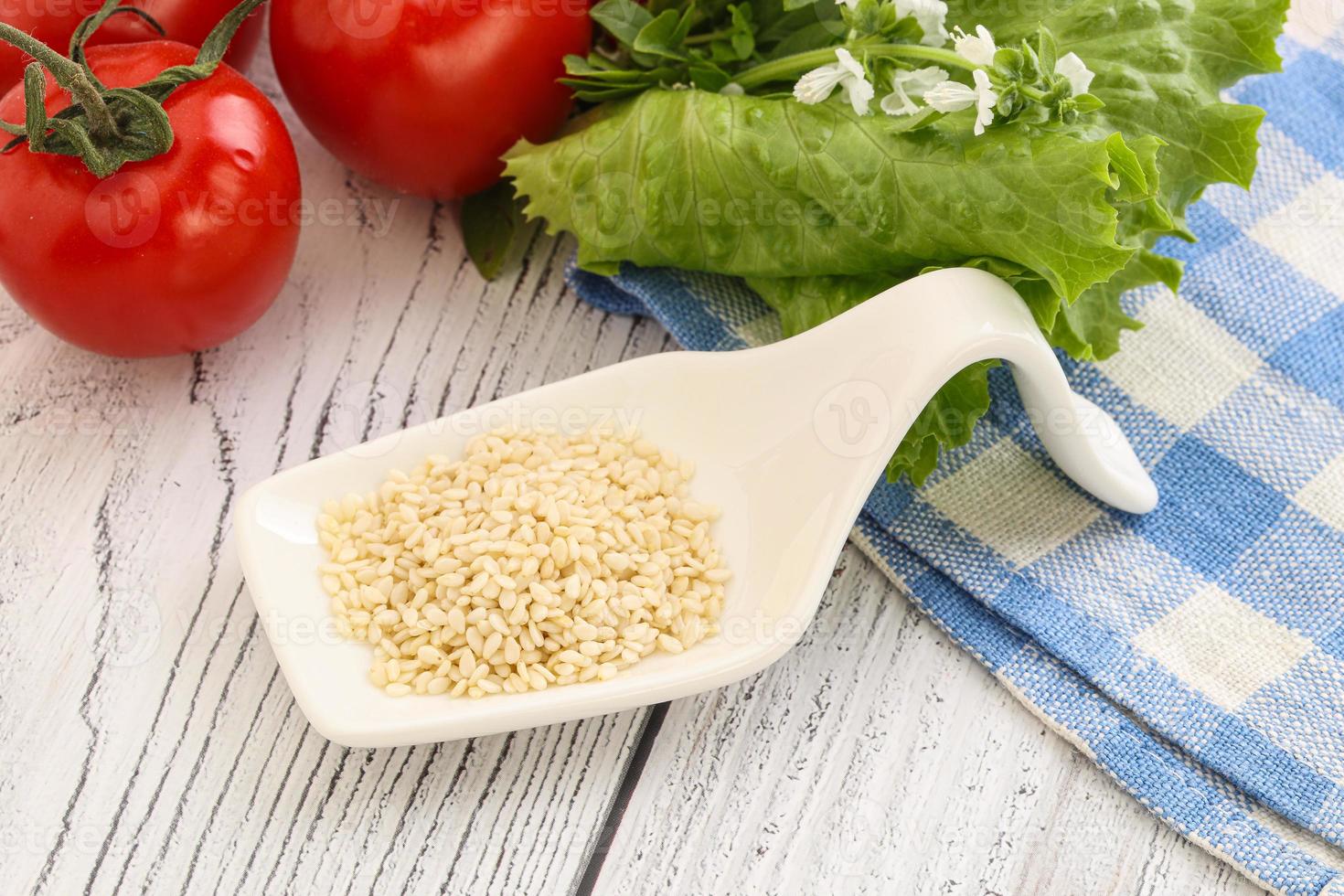 Raw sesame seeds in the bowl photo