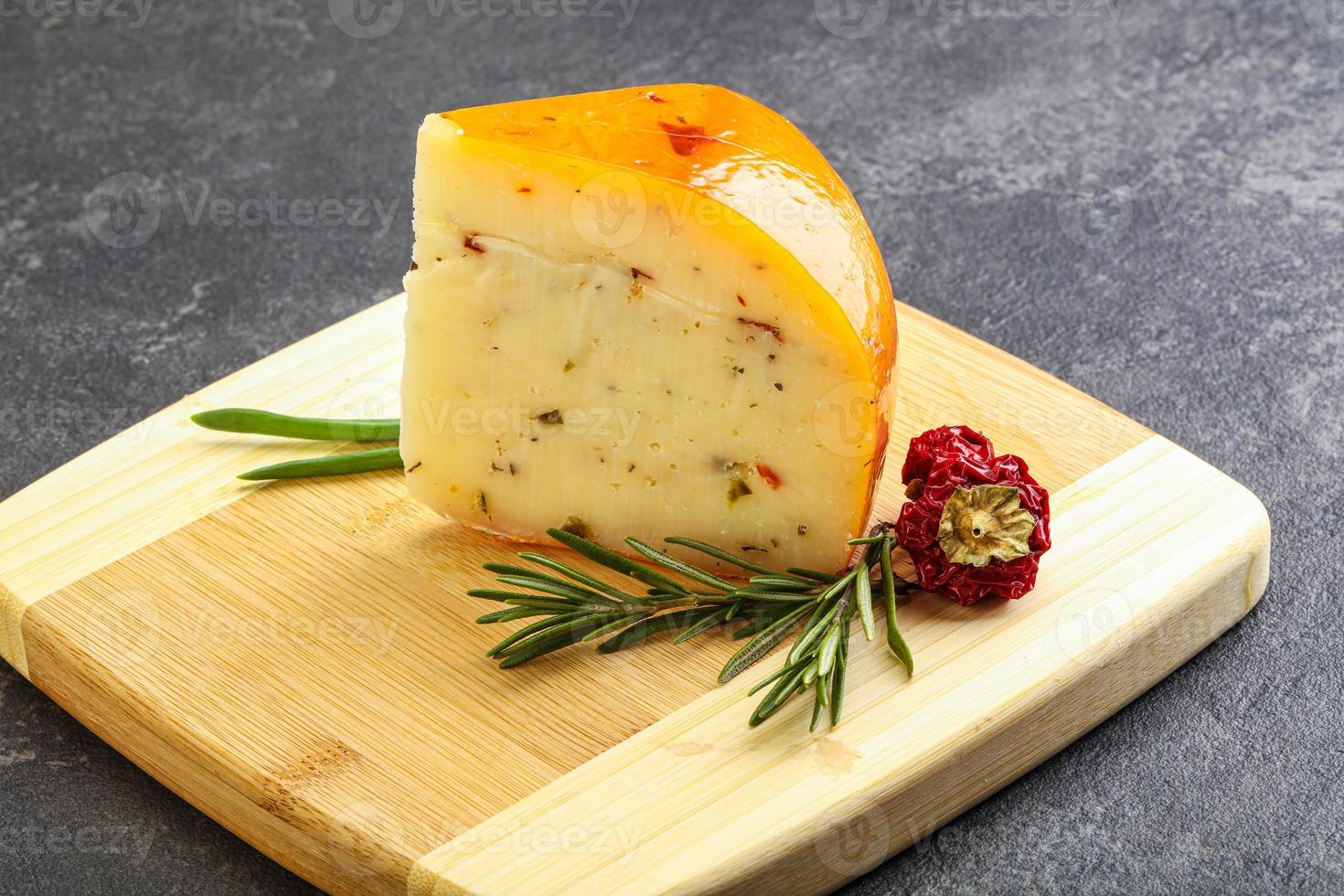 Hard cheese with dry tomato photo