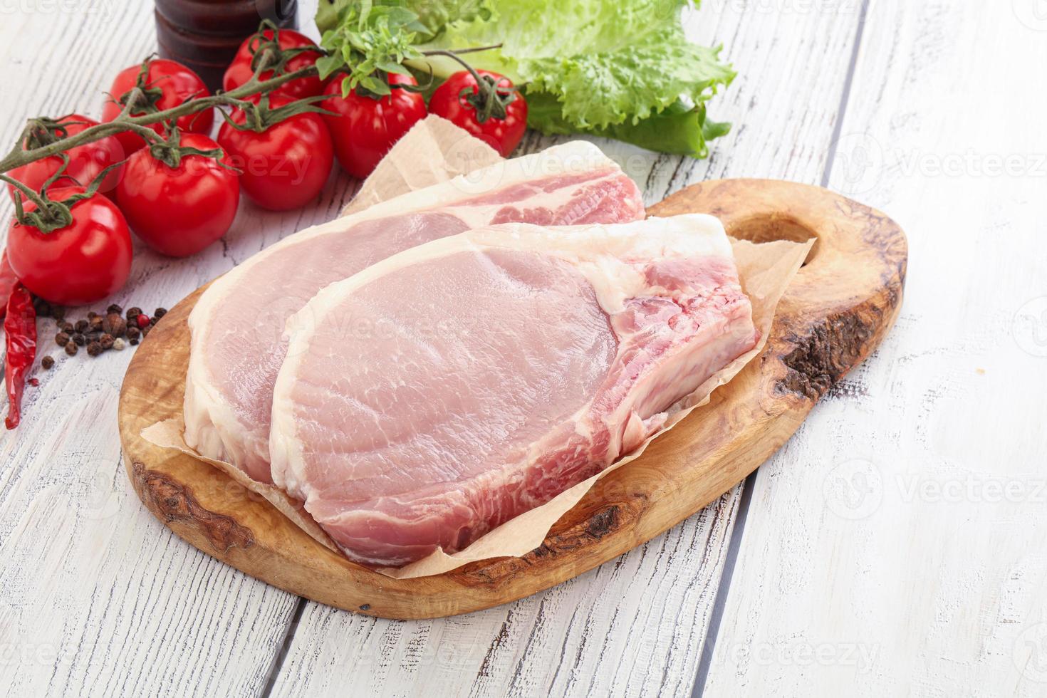 Raw pork t-bone steak for grill photo