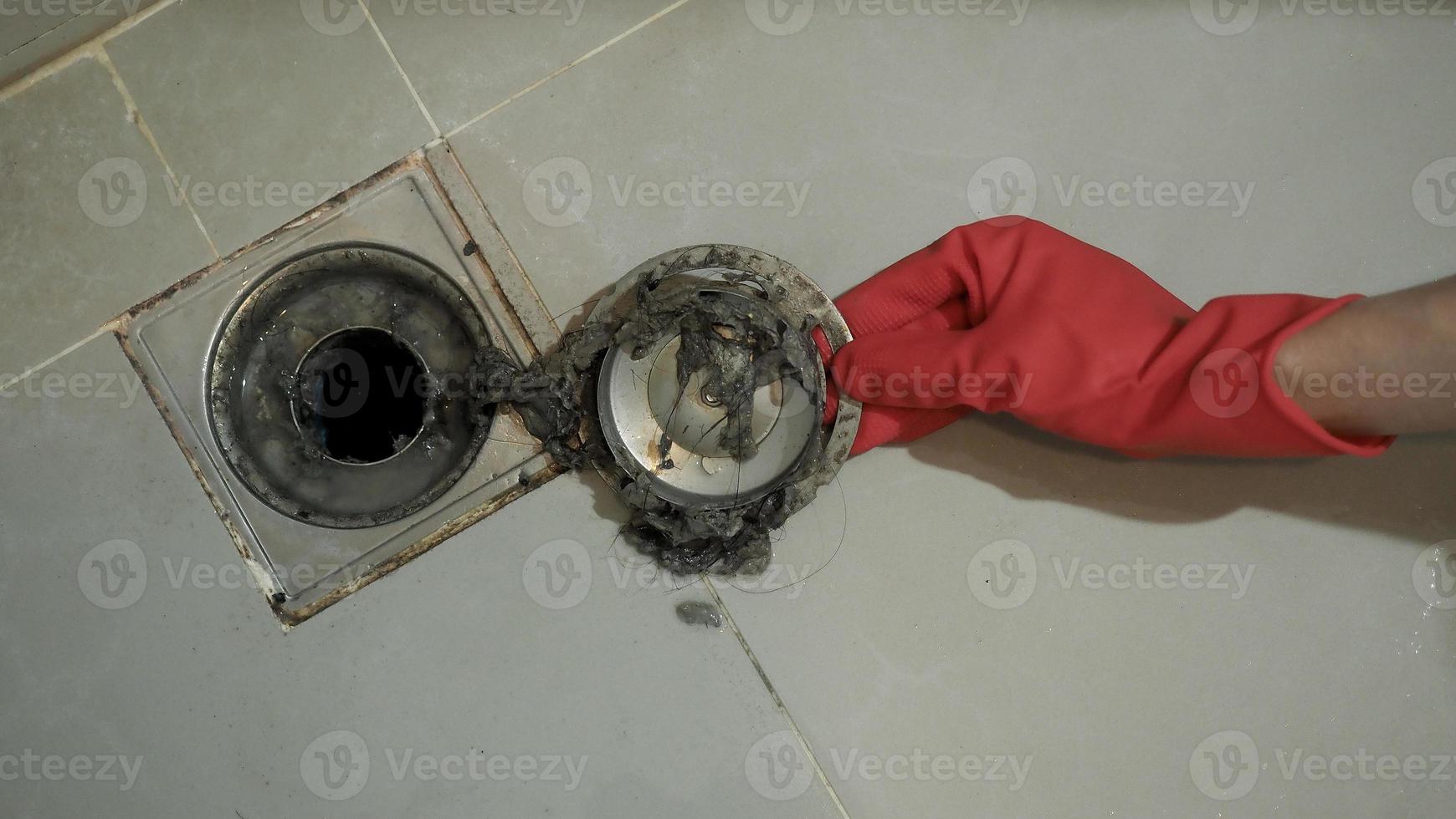 Drain cleaning. Clogged and dirty sewer pipes floor drain. photo