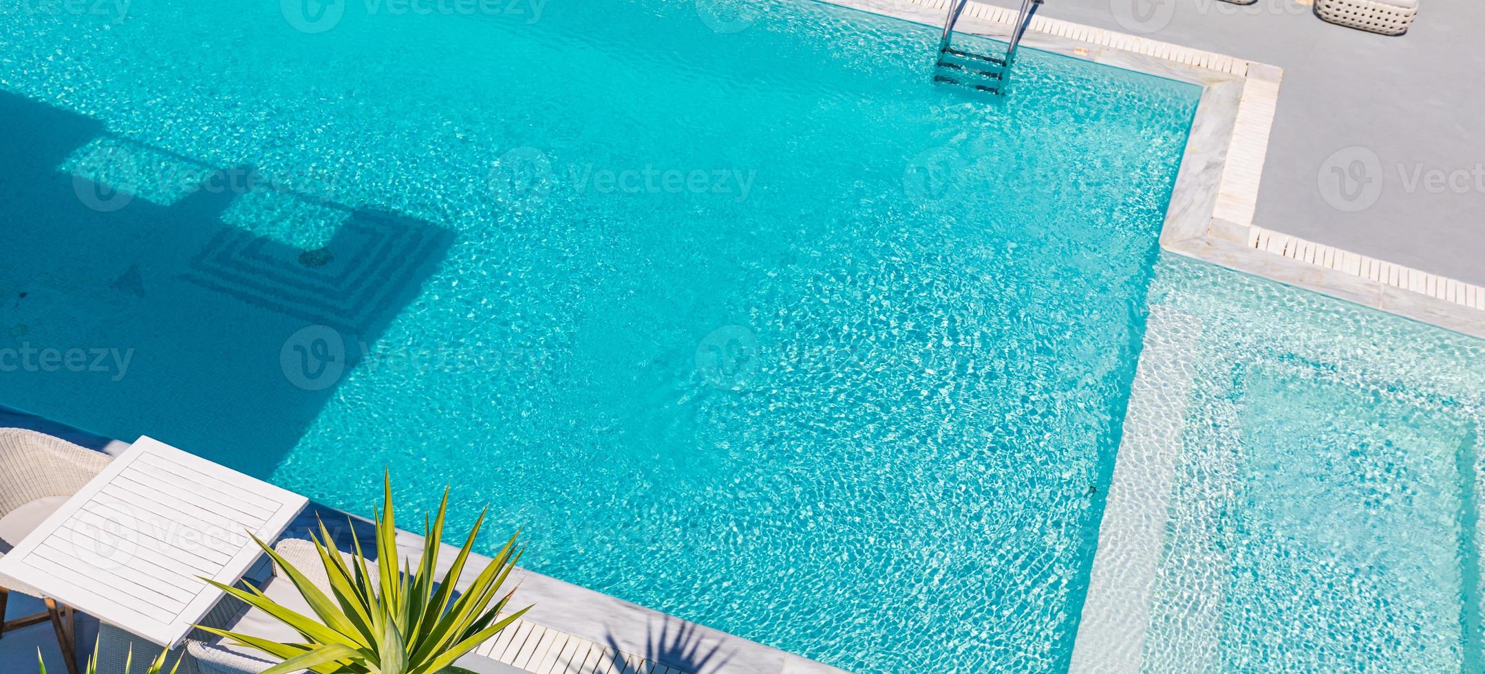 Swimming pool on top of roof deck building. Abstract view of summer pool with sunlight and relaxing mood, summer vibes. photo