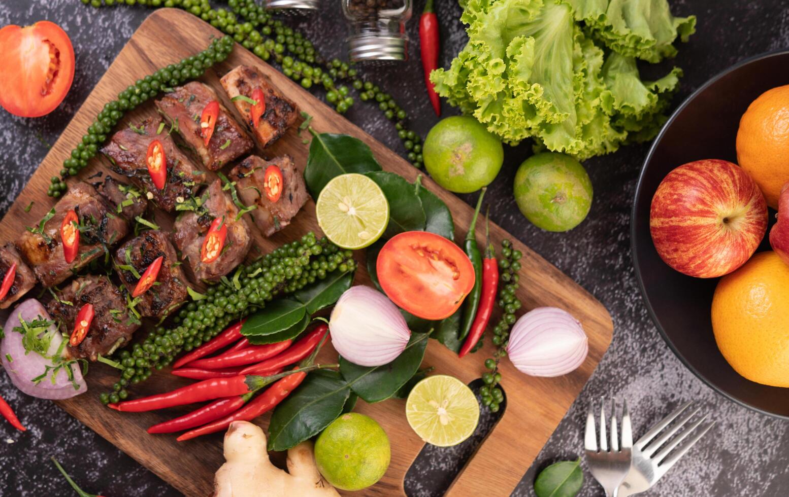 Pork steak topped with white sesame and fresh pepper seeds along. photo