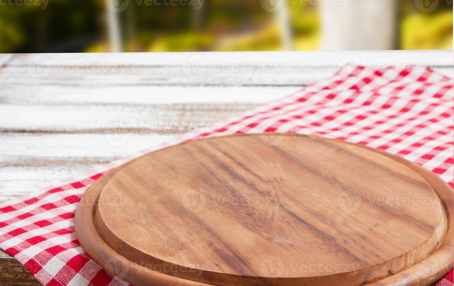 Napkin and board for pizza on wooden desk closeup, tablecloth. Canvas, dish towels on white wooden table background top view mock up. Selective focus photo