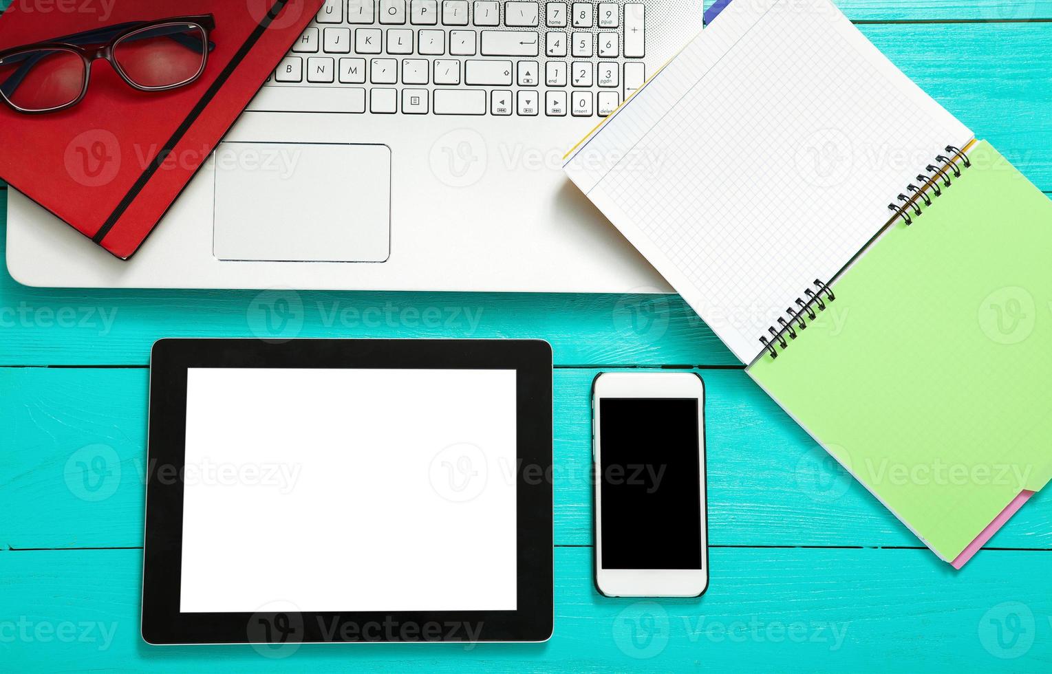 Workplace with business objects on blue wooden table. Top view and copy space photo