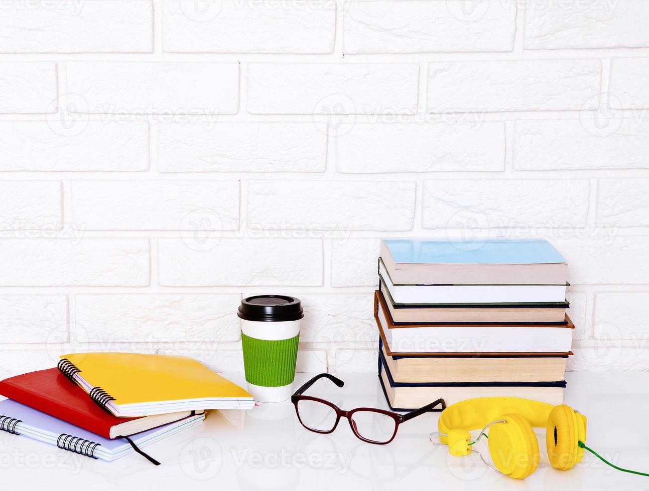 Workplace and education accessories on white table. Selective focus and copy space. Business school concept photo