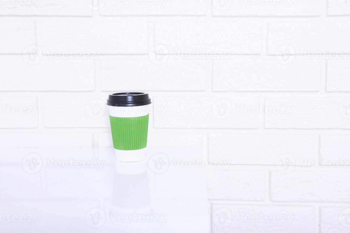 Stylish macro cup of coffee in office. Selective focus and copy space photo