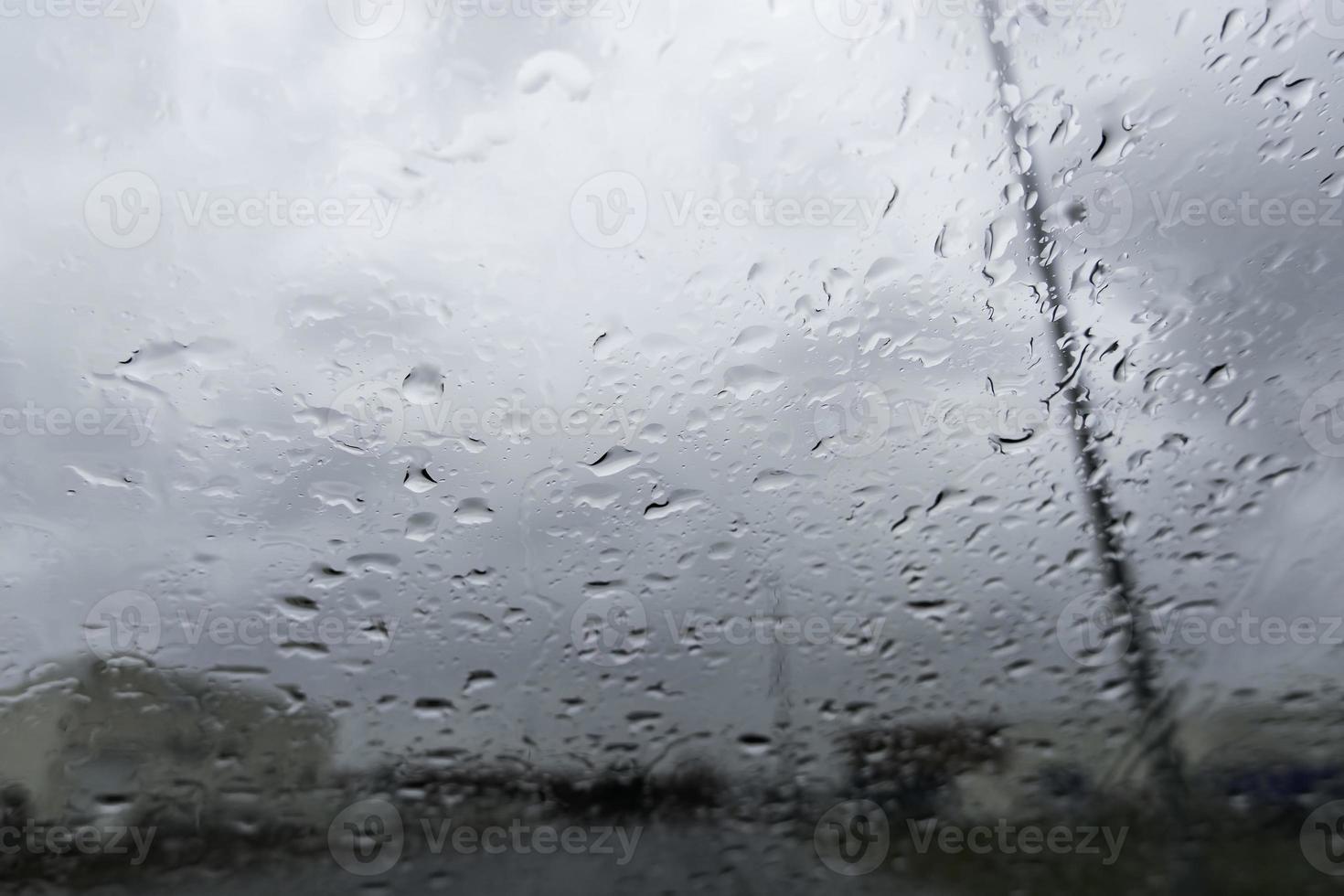 Glass wet by raindrops photo