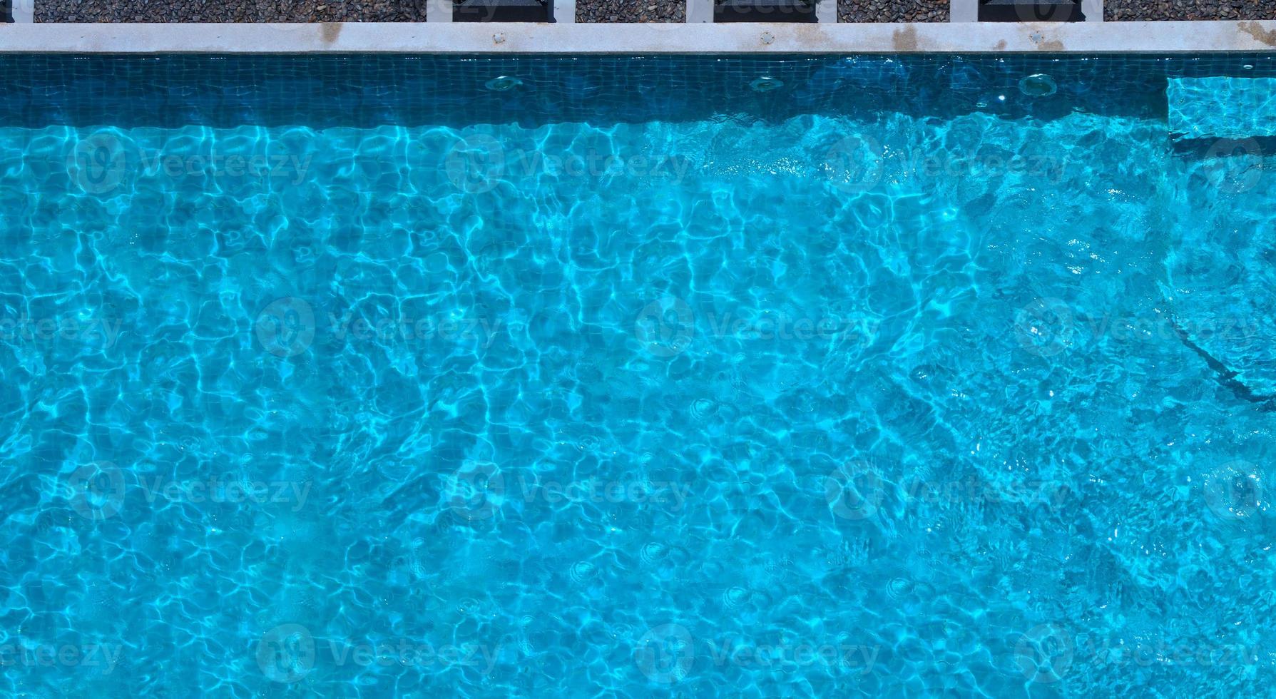 Aerial view images of swimming pool in a sunny day. photo