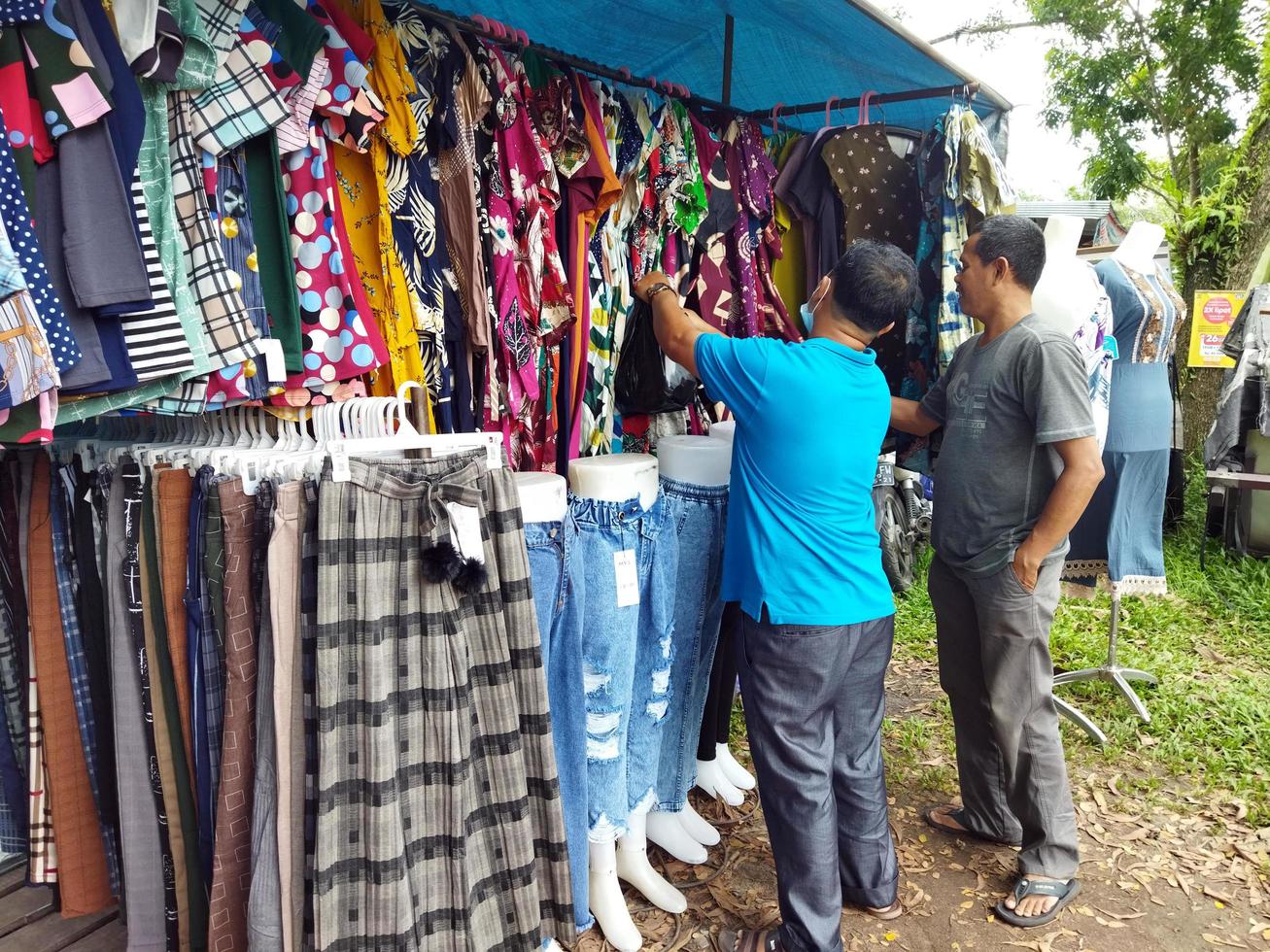 Kasongan, Indonesia. May 7, 2022-Buyer bidding on clothes photo