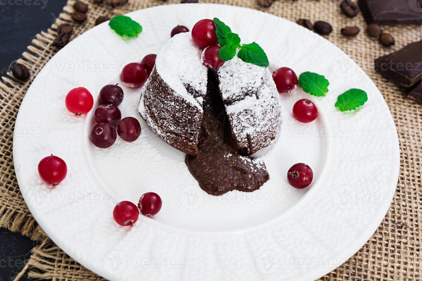 Chocolate fondant with cranberry sauce. photo