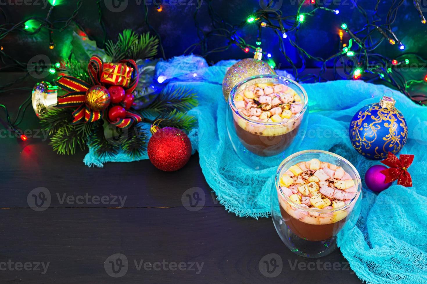 Cup of hot cocoa with marshmallows on Christmas background photo
