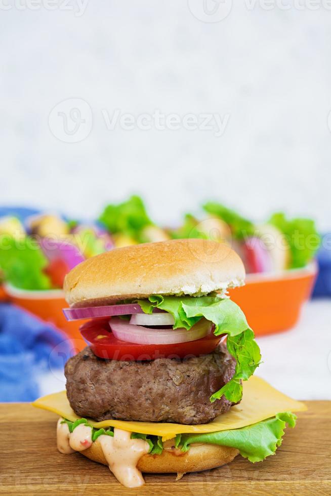 Delicious handmade burger on white background photo