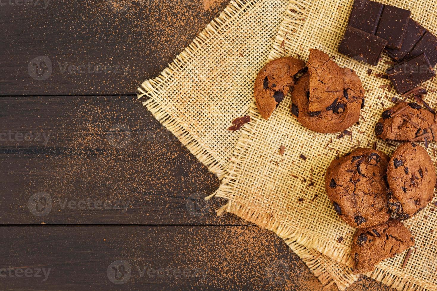Cookies with chocolate on dark wooden background photo