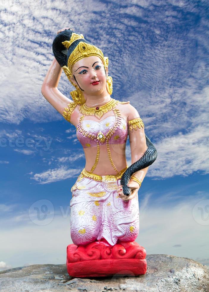 Statue of Mother Earth, clouds, sky. photo