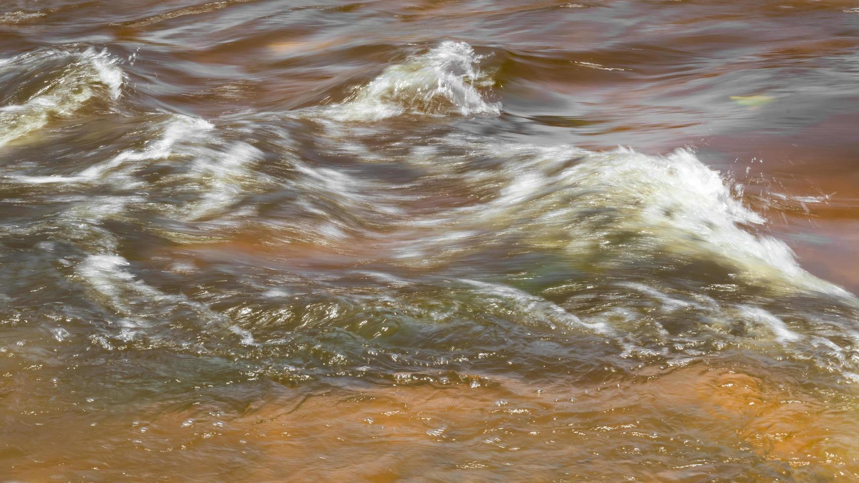 Streams of water flooded the rocks. photo