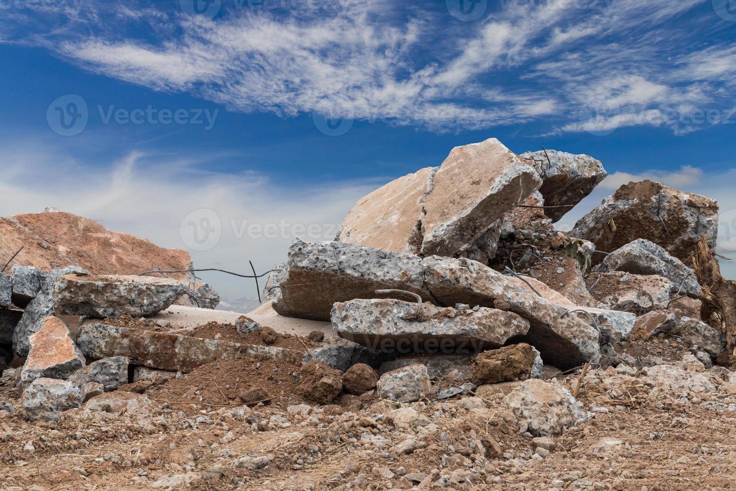 Concrete debris with sky clouds. photo