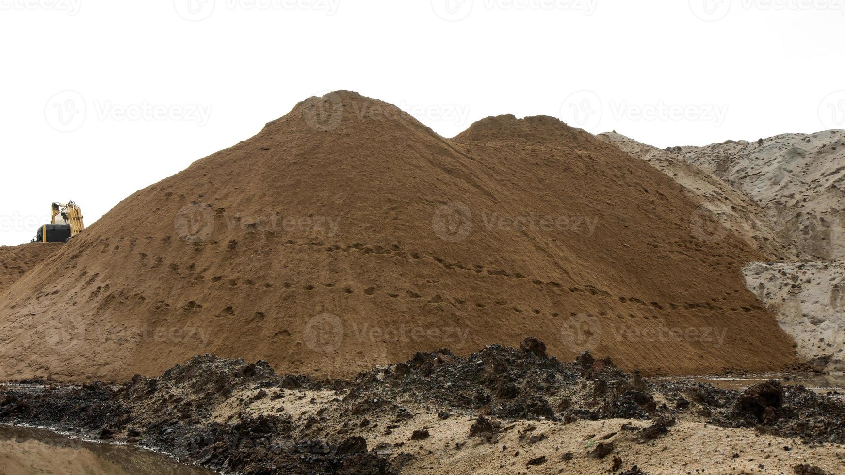 Footprints in the sand with backhoe. photo