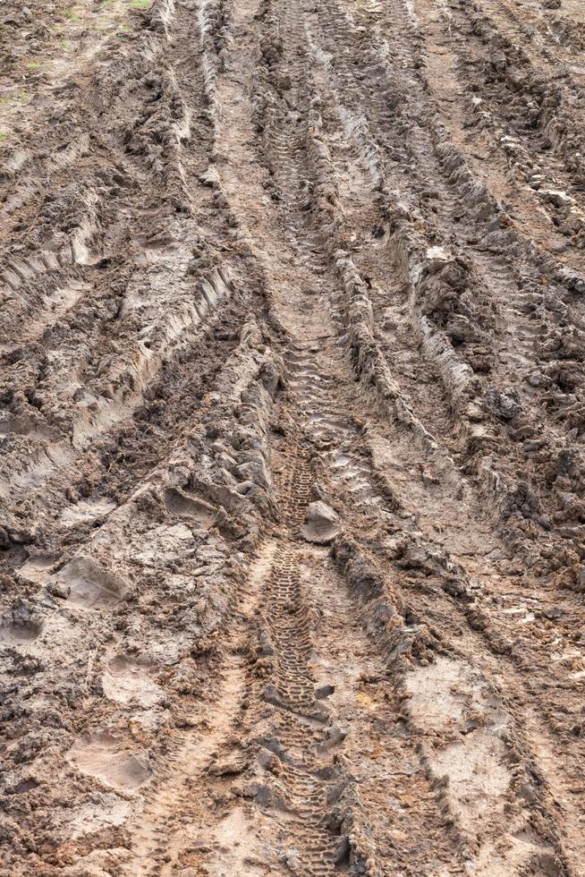 Tracks the wheels on wet mud roads. photo